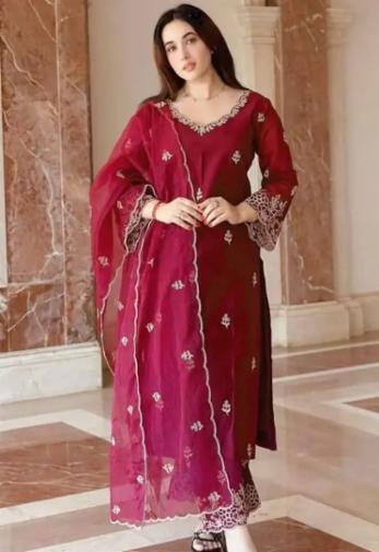 salwar kameez with a matching dupatta. The outfit features delicate white embroidery