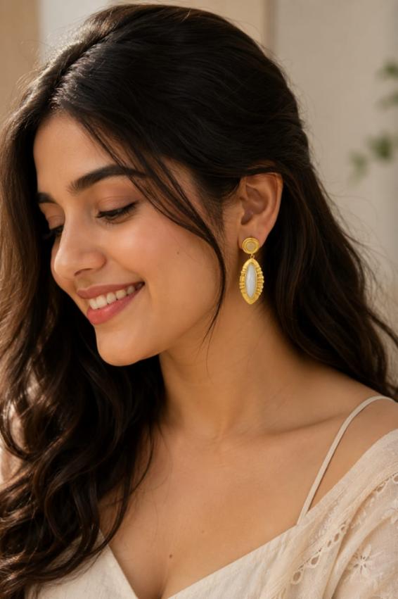 Matte Gold-Plated Tribal Leaf Drop Earrings with Milky White Stone
